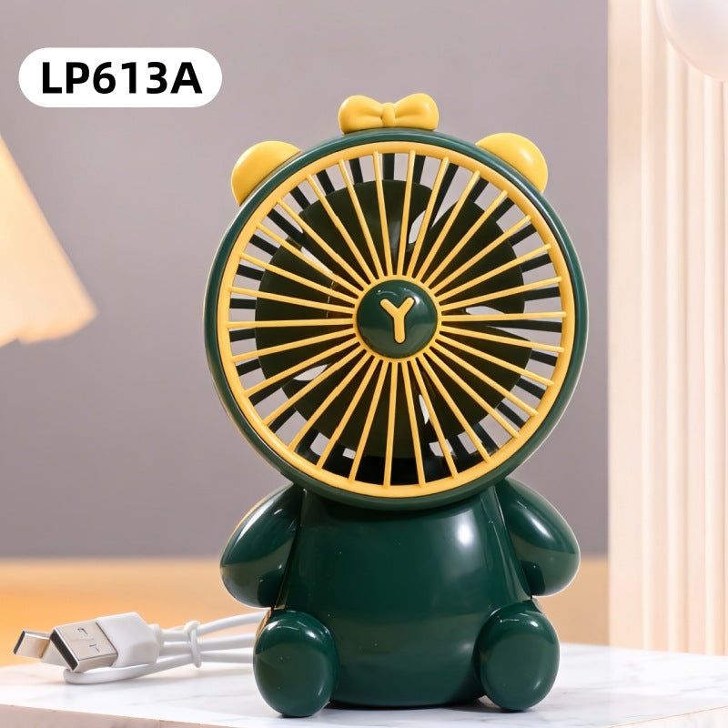 Green and yellow fan shaped like a bear with a USB cable on a light background