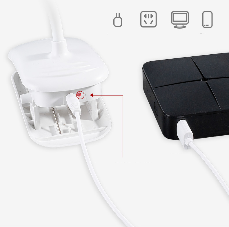 White electronic device with a cable and black rectangular device on a white background
