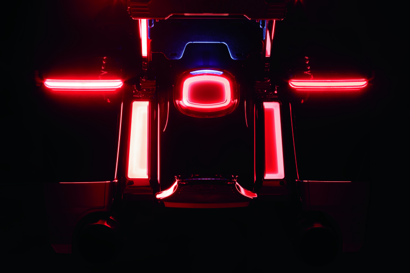 Close-up of a vehicle's red brake lights in a dark setting