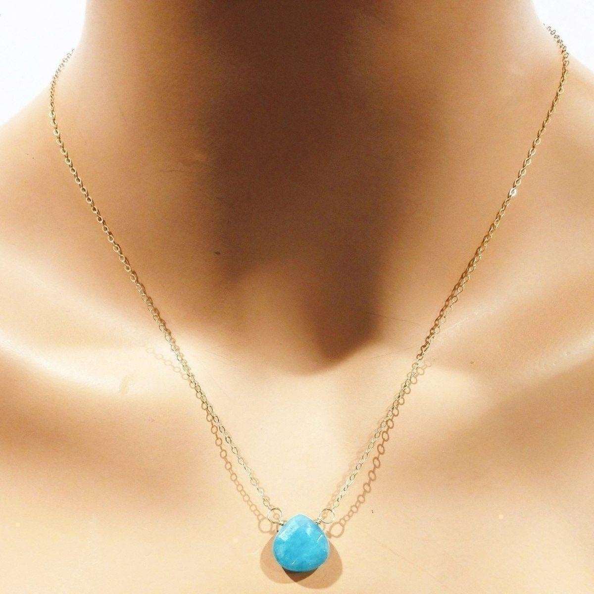 Necklace with a jade pendant on a mannequin