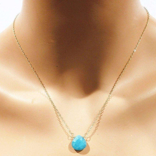 Necklace with a jade pendant on a mannequin