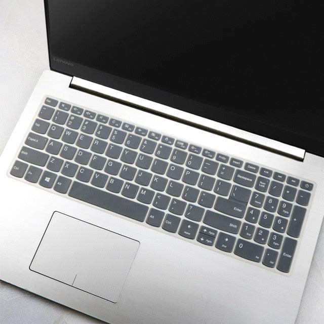 Laptop with a keyboard cover on a light surface