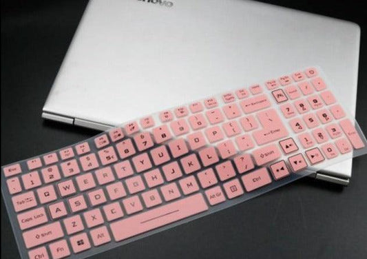 Pink keyboard cover on a laptop with a black background