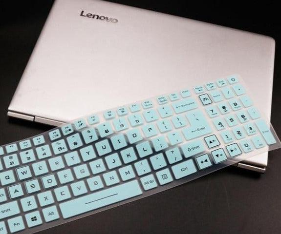 Lenovo laptop with a keyboard cover on a dark surface
