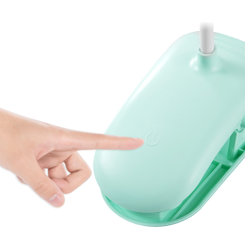 Green electronic device with a hand pointing at it on a white background