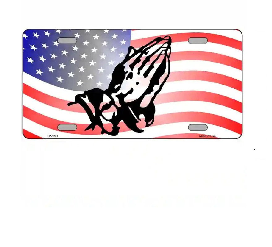 License plate with American flag design and praying hands symbol