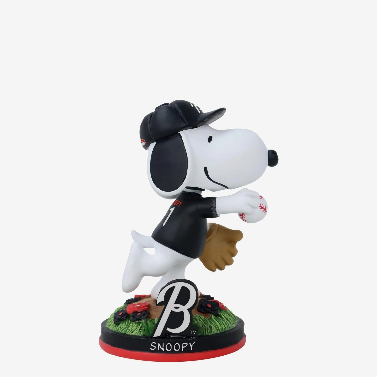 Snoopy figurine with a baseball cap and glove on a white background