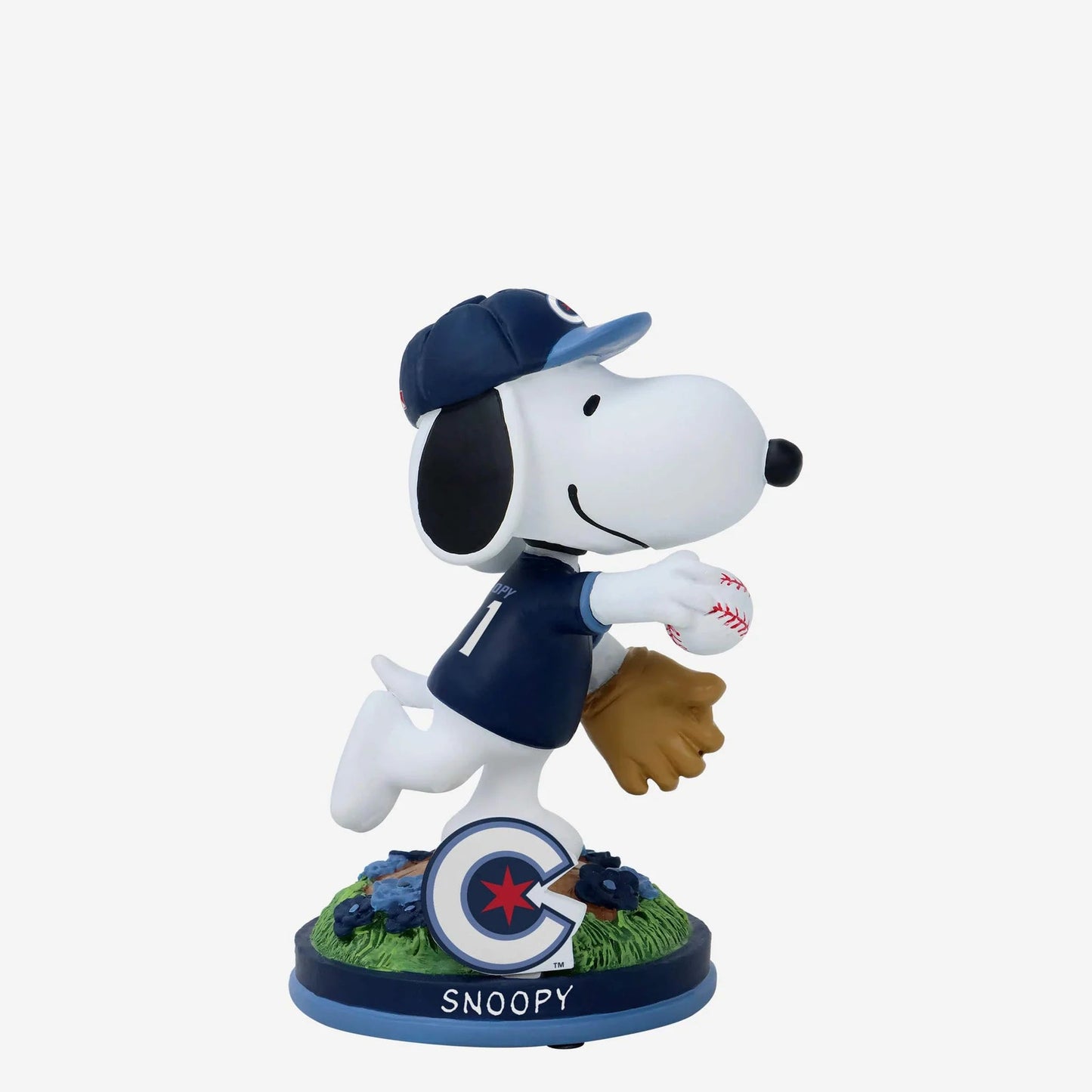 Snoopy figurine in a baseball uniform with a ball and glove on a white background