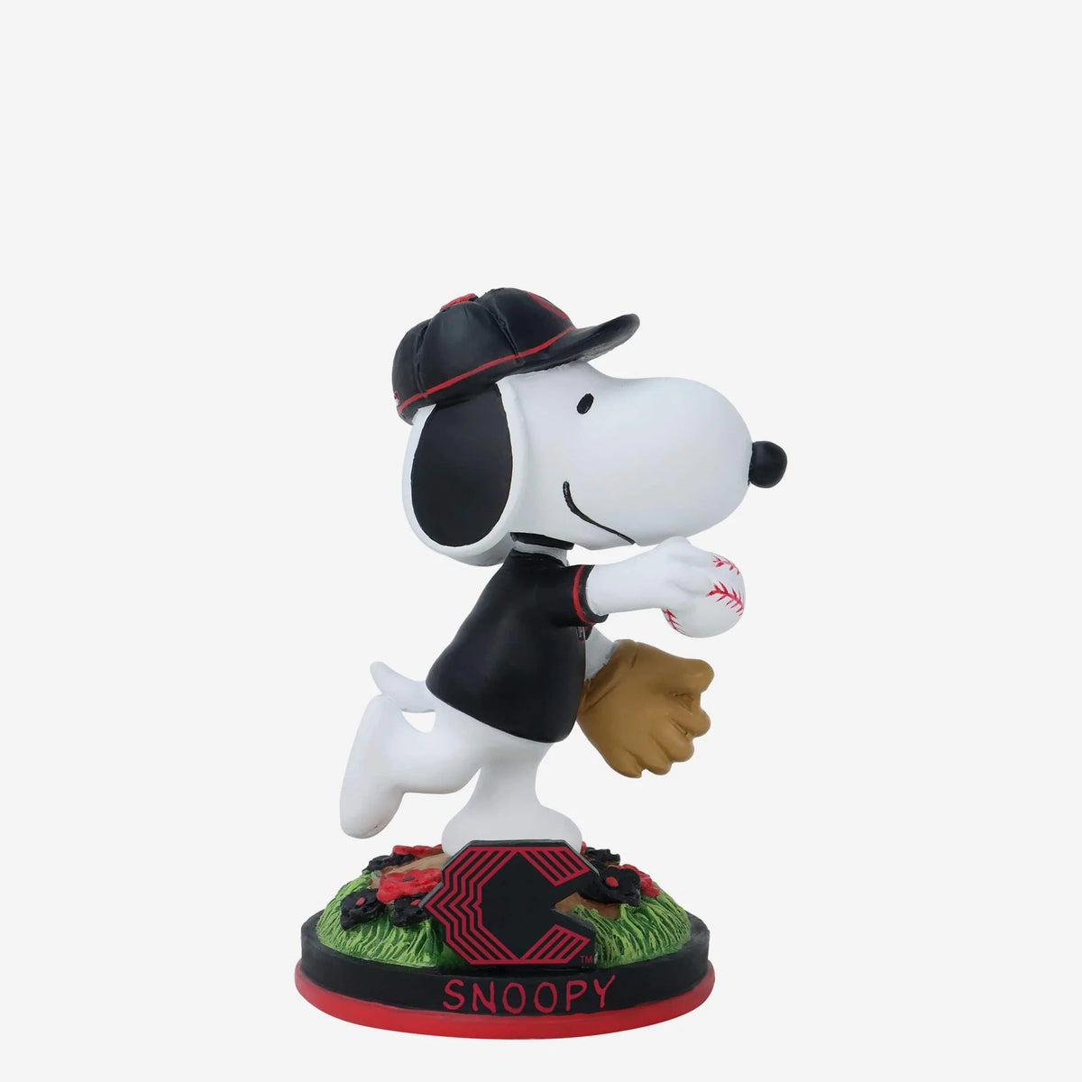 Snoopy figurine in a baseball pose with a cap and glove on a white background