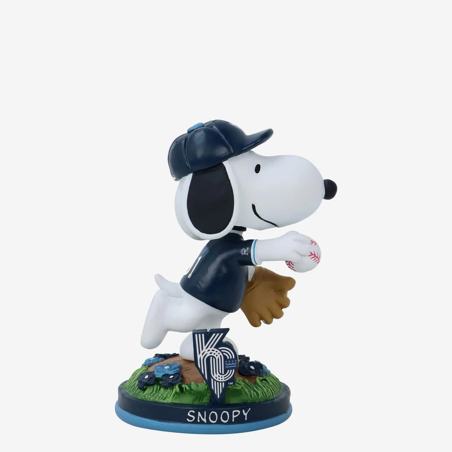 Snoopy figurine in a baseball uniform with a cap and glove on a white background