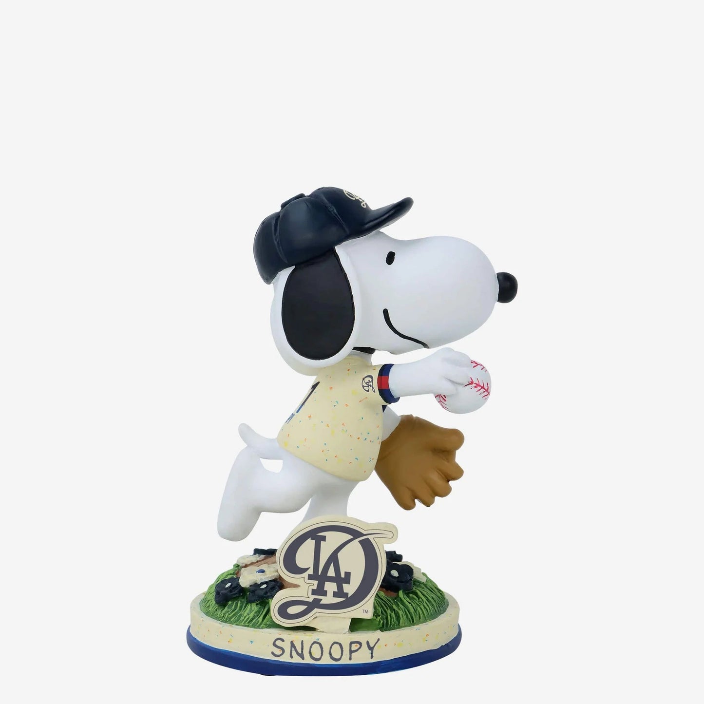 Snoopy figurine in a baseball uniform with a cap and glove, holding a ball, on a white background.