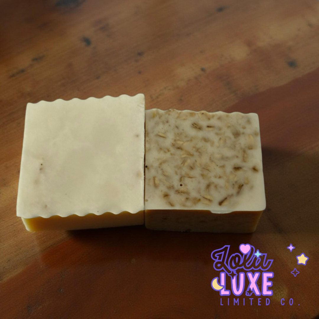 Two soap bars on a wooden surface with 'Lola Luxe Limited Co.' branding.