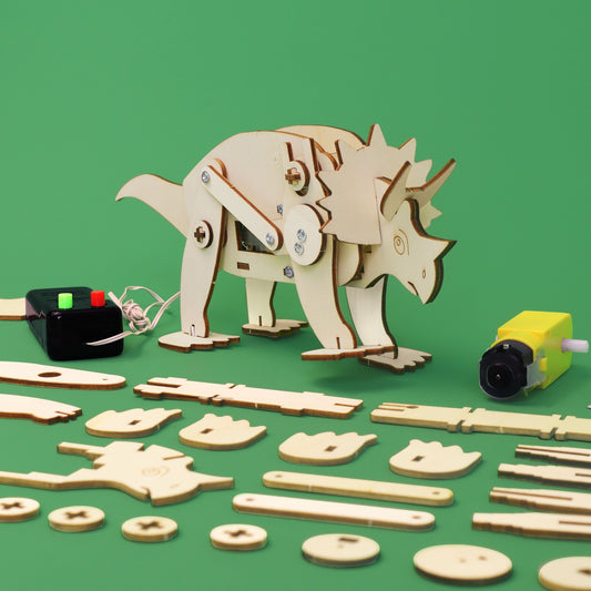 Wooden dinosaur model kit with pieces on a green background