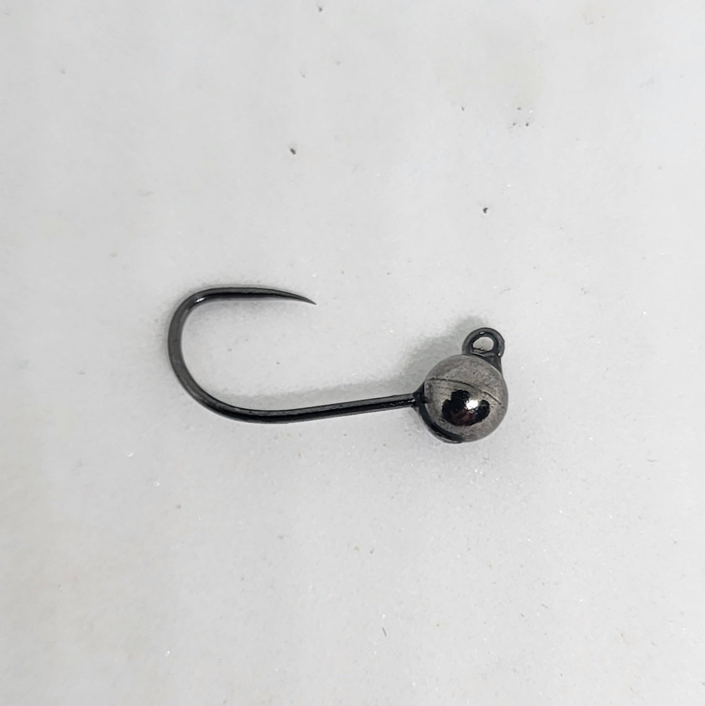 Fishing hook with a ball sinker on a white background