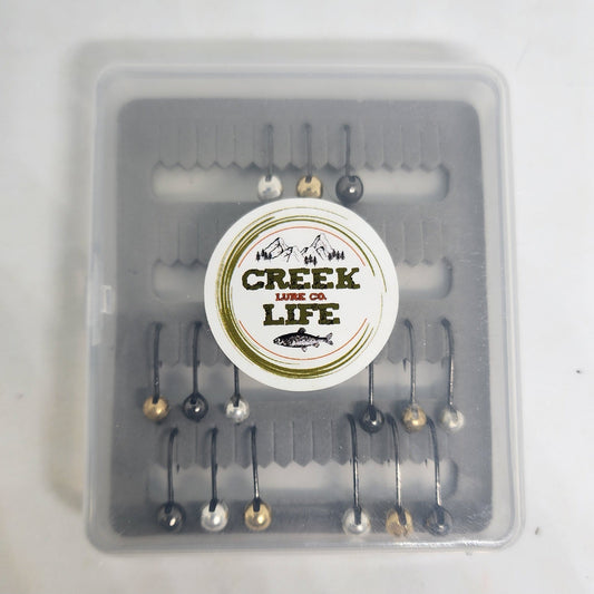 Fishing lure set in a clear container with 'Creek of Life' branding on a white background.
