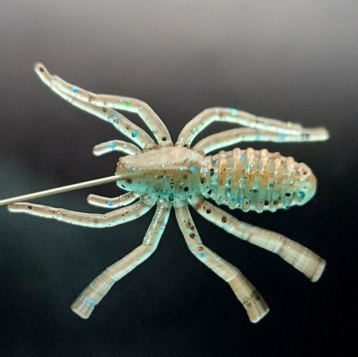Artificial spider lure on a black background