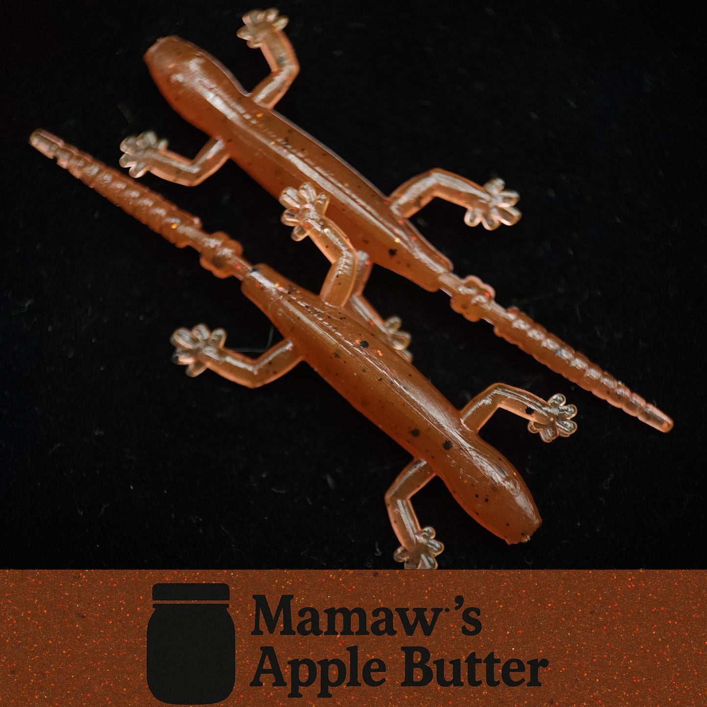 Gummy lizard fishing lure with 'Mamaw's Apple Butter' branding on a dark background