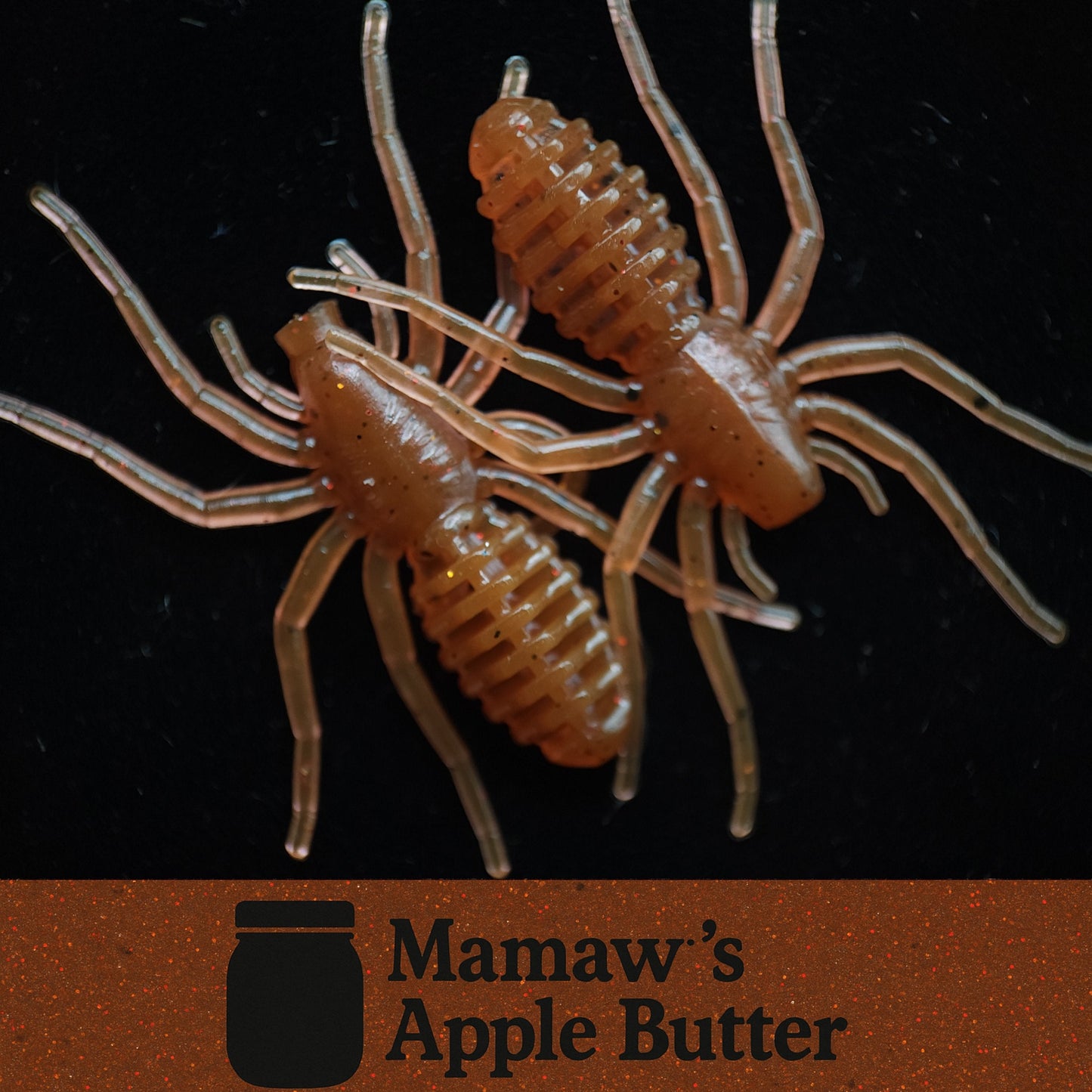 Two brown spider-like lures on a black background with 'Mamaw's Apple Butter' logo.