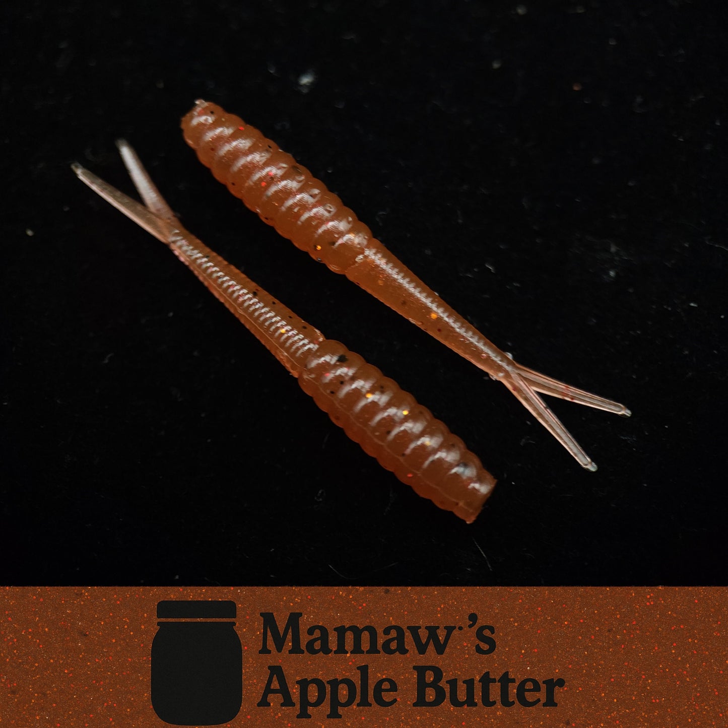 Two brown fishing lures on a black background with 'Mamaw's Apple Butter' branding.