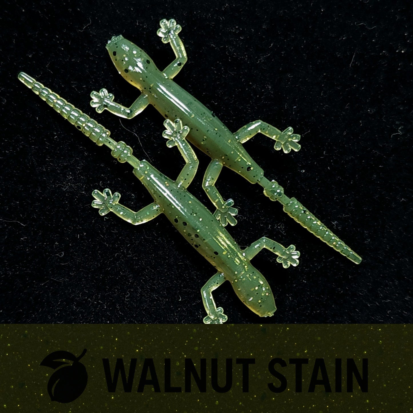 Artificial lizard lure with 'Walnut Stain' branding on a black background