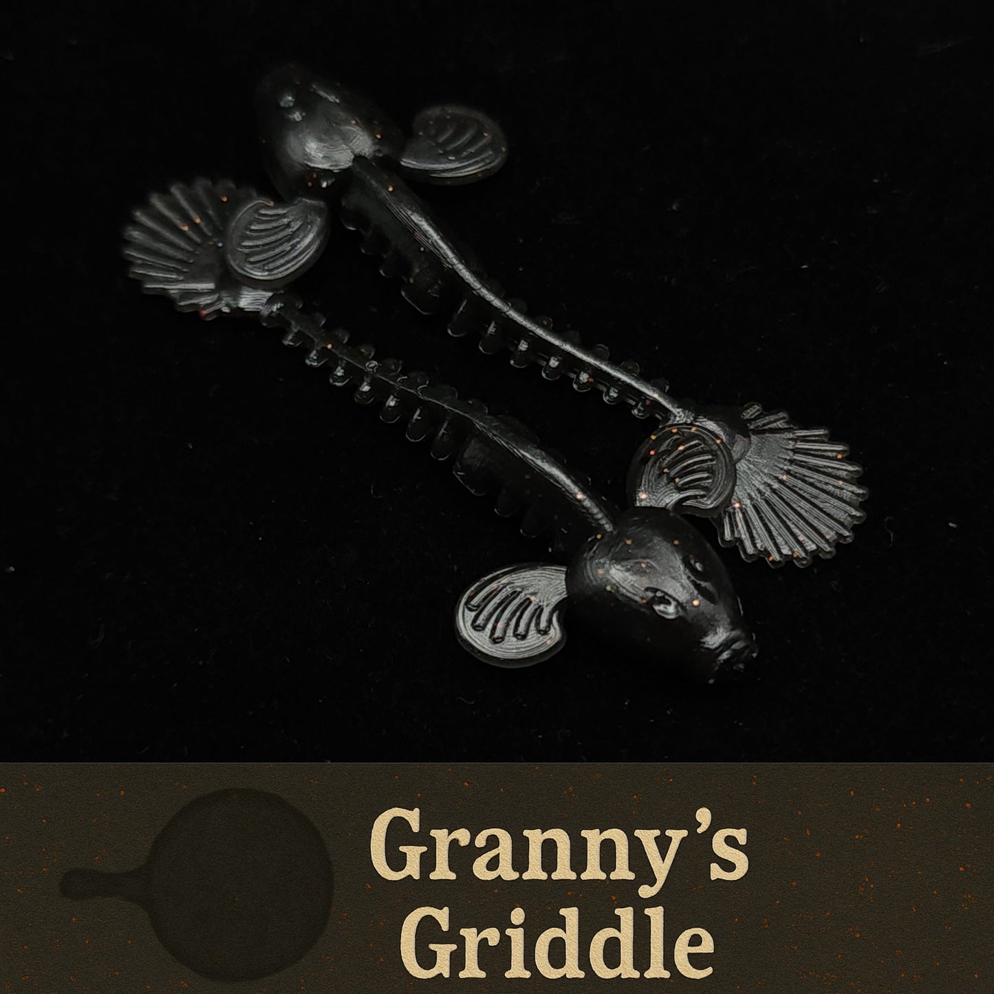 Blackfishing lures with 'Granny's Griddle' branding on a black background