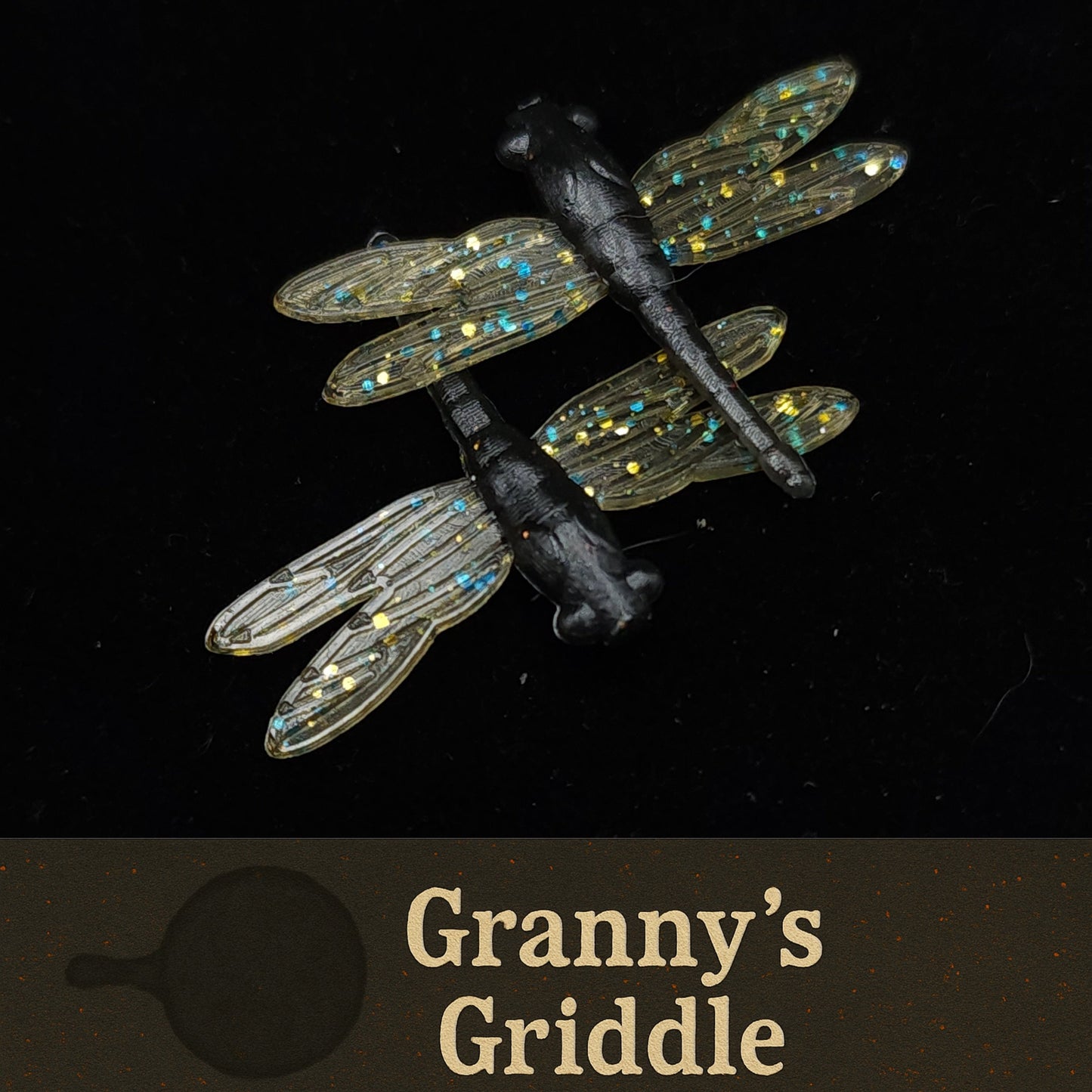 Dragonfly-shaped Fishing Lures with 'Granny's Griddle' branding on a black background