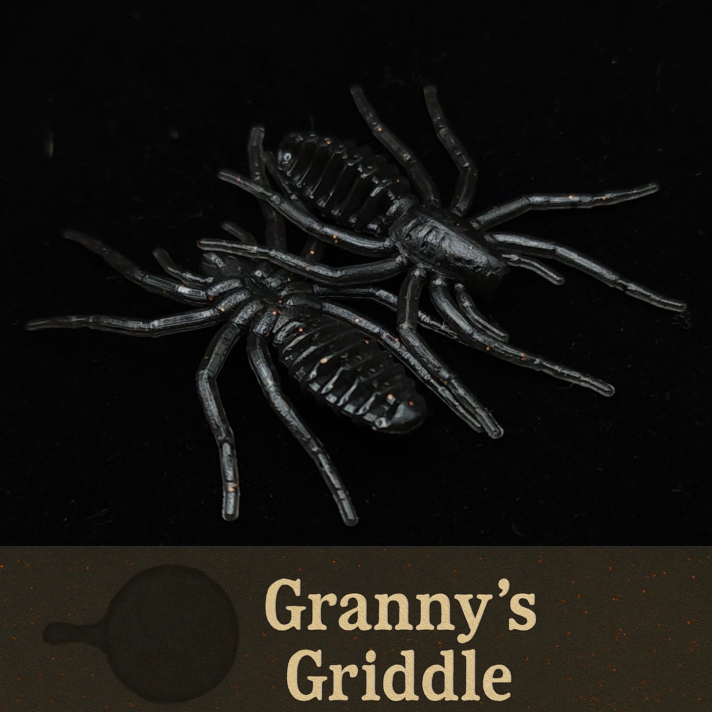 Black spider-like lures with 'Granny's Griddle' text on a dark background