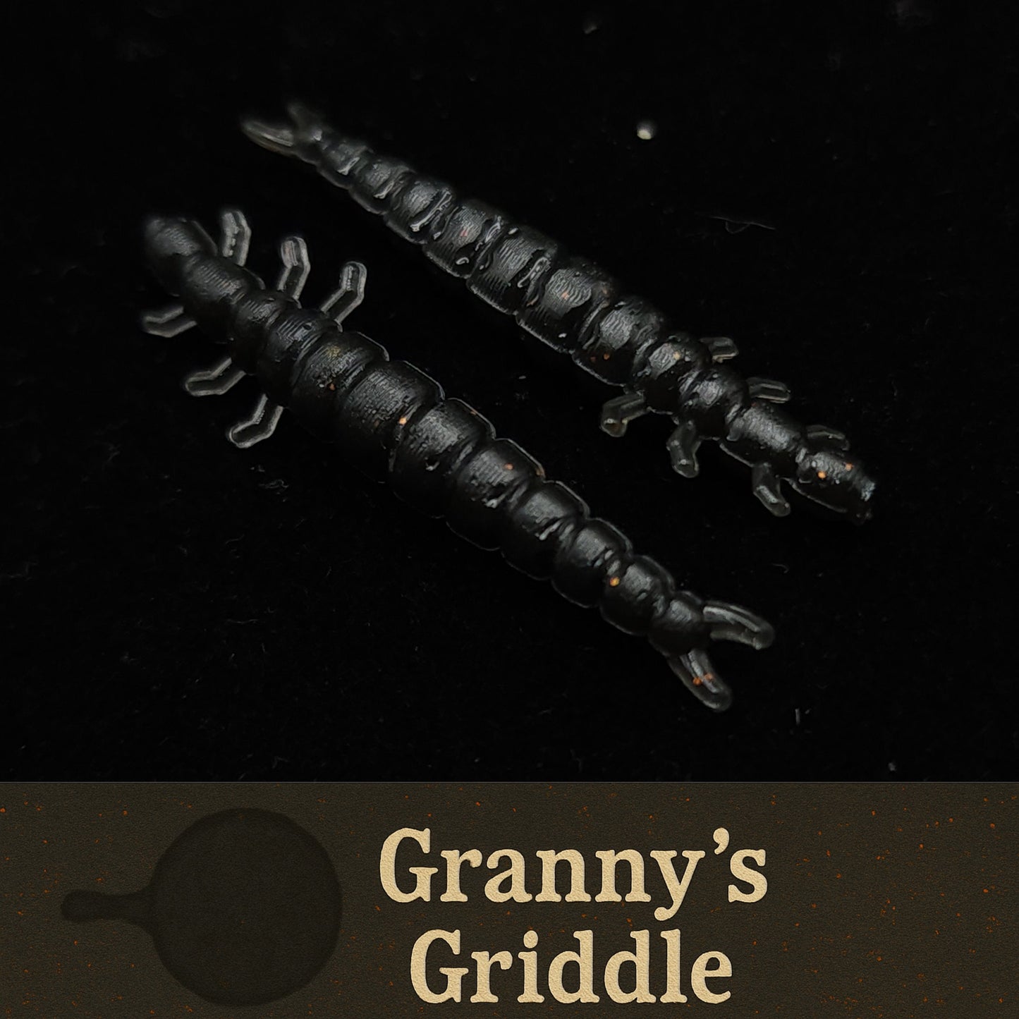 Two black fishing lures on a dark background with 'Granny's Griddle' text.