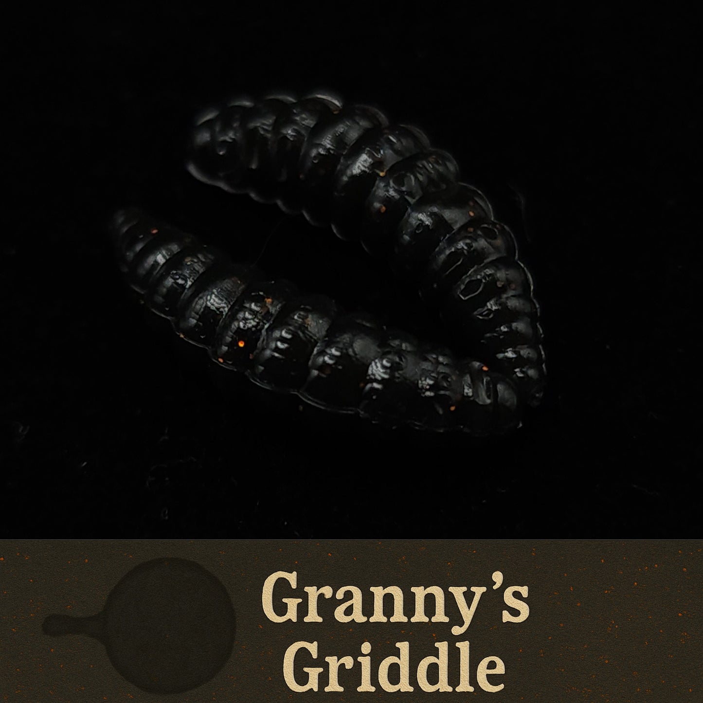 Black textured fishing lures with 'Granny's Griddle' branding on a dark background
