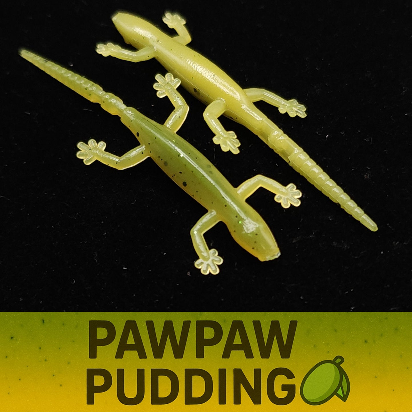 Two green salamander shaped fish lures on a black background with 'Pawpaw Pudding' text below.