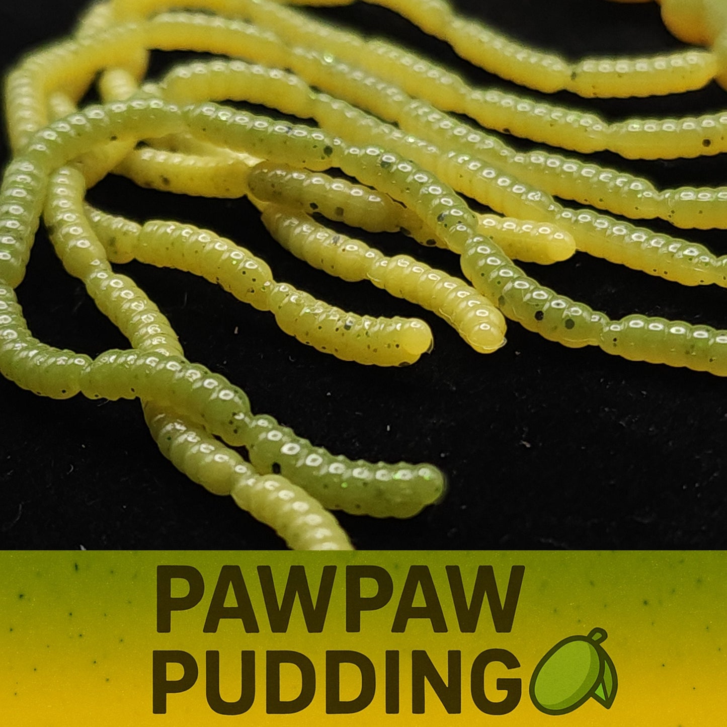 Yellow worm-like Micro Maggot Fly Larvae lures with 'Pawpaw Pudding' text and logo on a black background