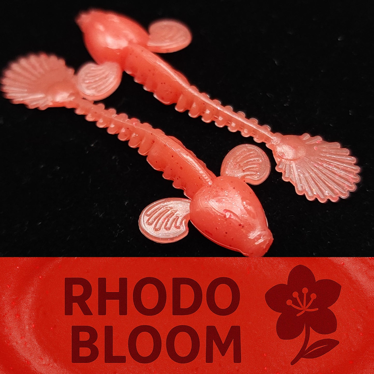 Pink fishing lures with 'Rhodo Bloom' branding on a black background