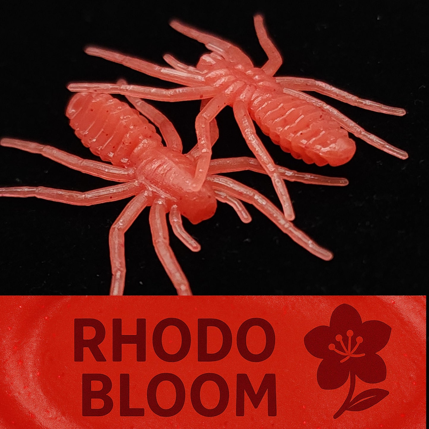 Red crawfish lures with 'Rhodo Bloom' branding on a black background