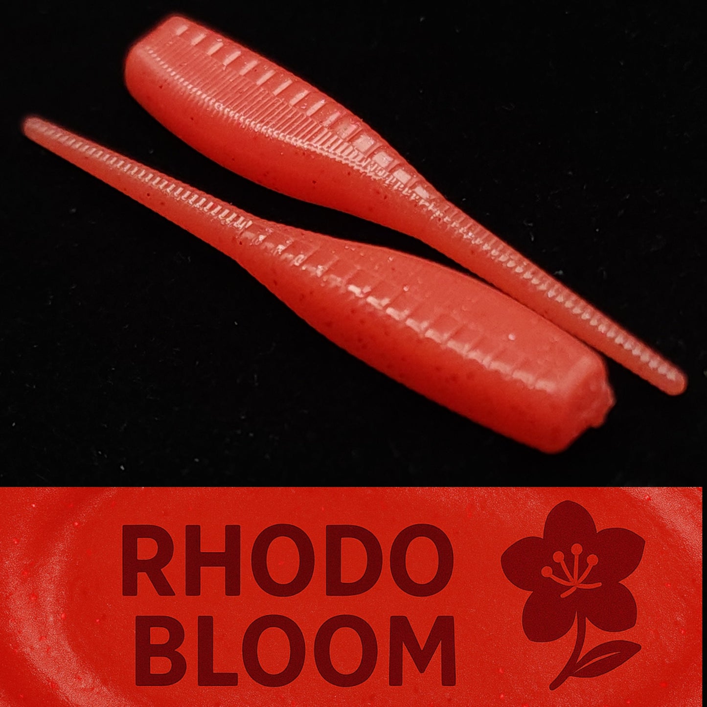 Two red fishing lures on a black background with 'Rhodo Bloom' branding.