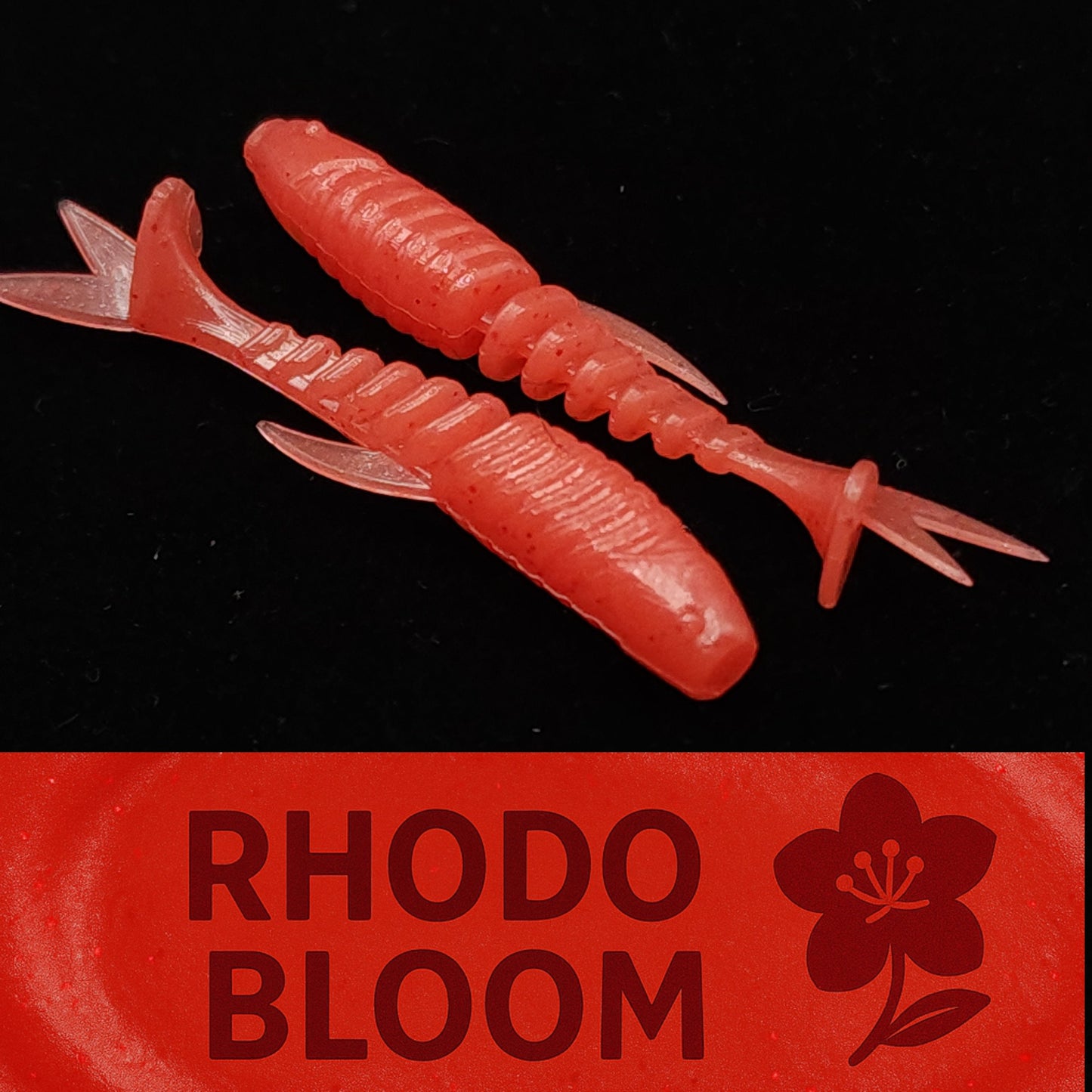 Two red fishing lures with 'Rhodo Bloom' branding on a black background