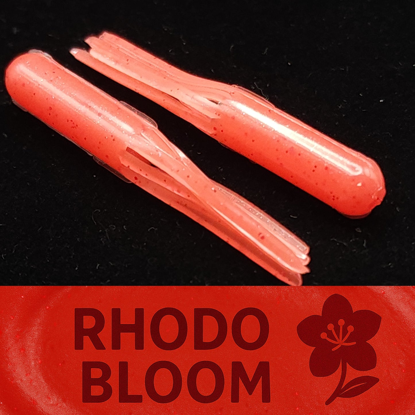 Two red fishing lures on a black background with 'Rhodo Bloom' branding.