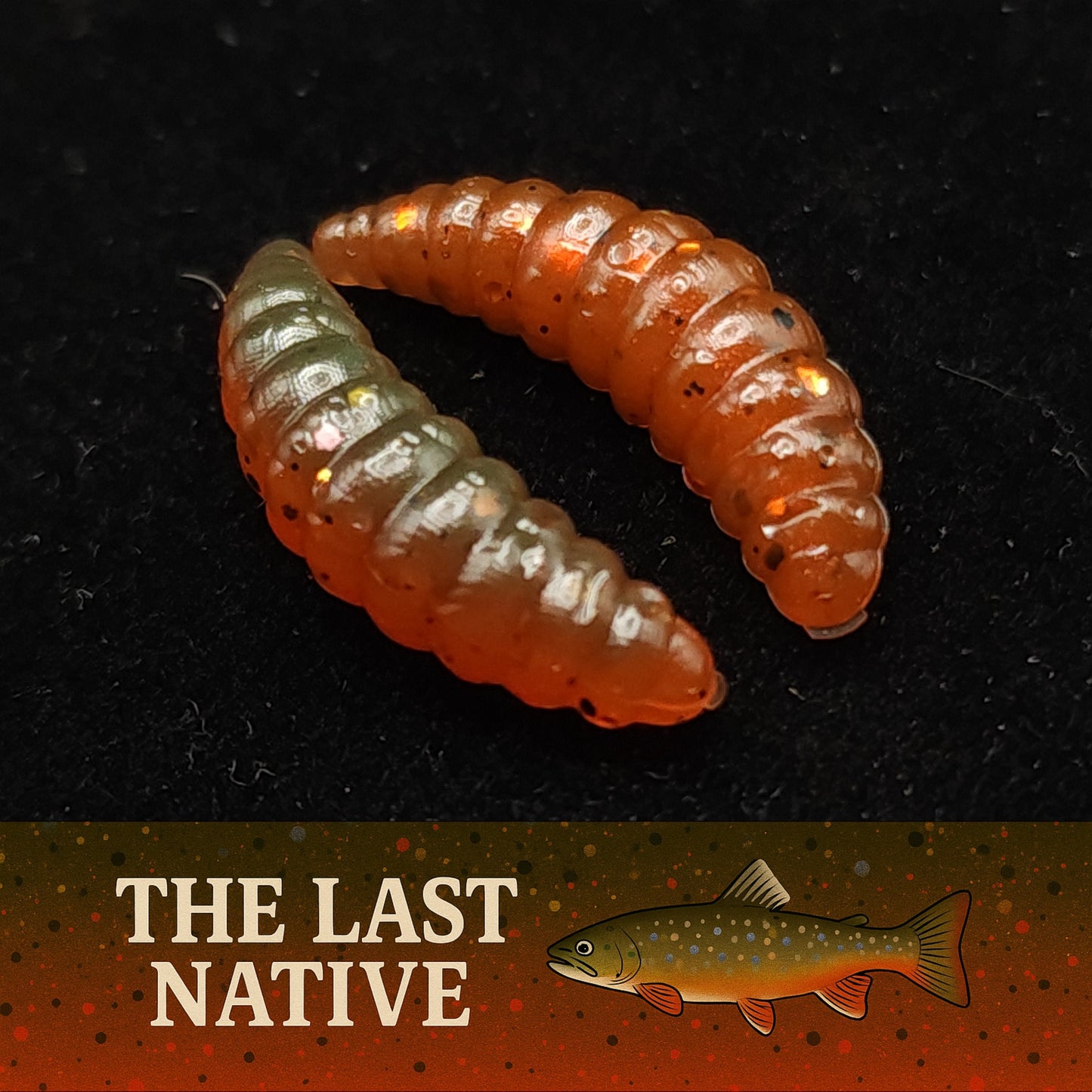 Orange and white larva  fishing lures on a black background with 'The Last Native' branding.