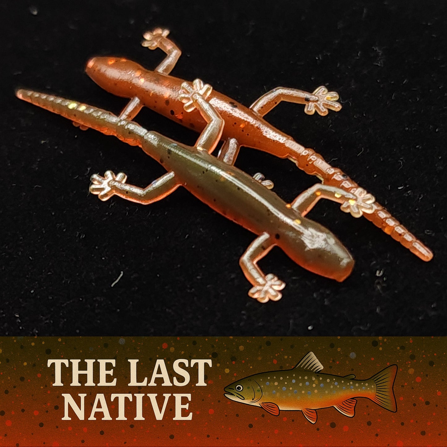 Two soft plastic fishing lures resembling geckos on a dark background with 'The Last Native' branding.