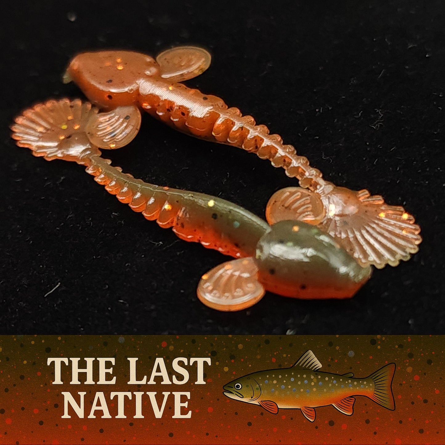 Artificial fishing lure resembling a worm with 'The Last Native' branding on a dark background.