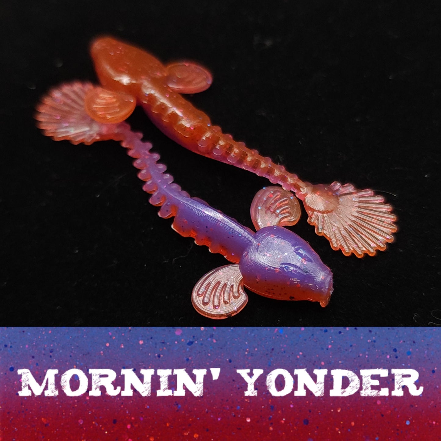 Pink and purple fishing lure with 'Mornin' Yonder' text on a dark background