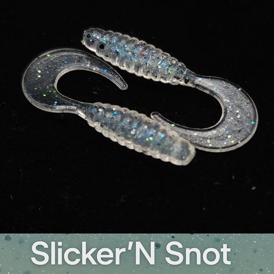 Two fishing lures labeled 'Slicker'N Snot' on a black background