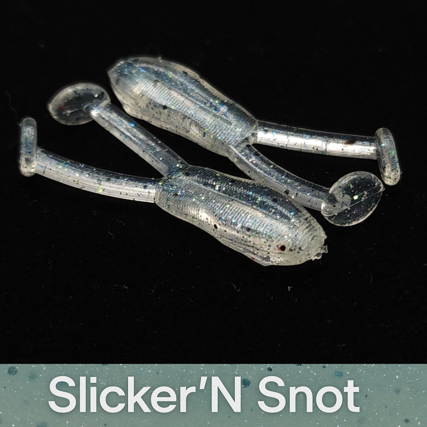 Fishing lures labeled 'Slicker'N Snot' on a black background