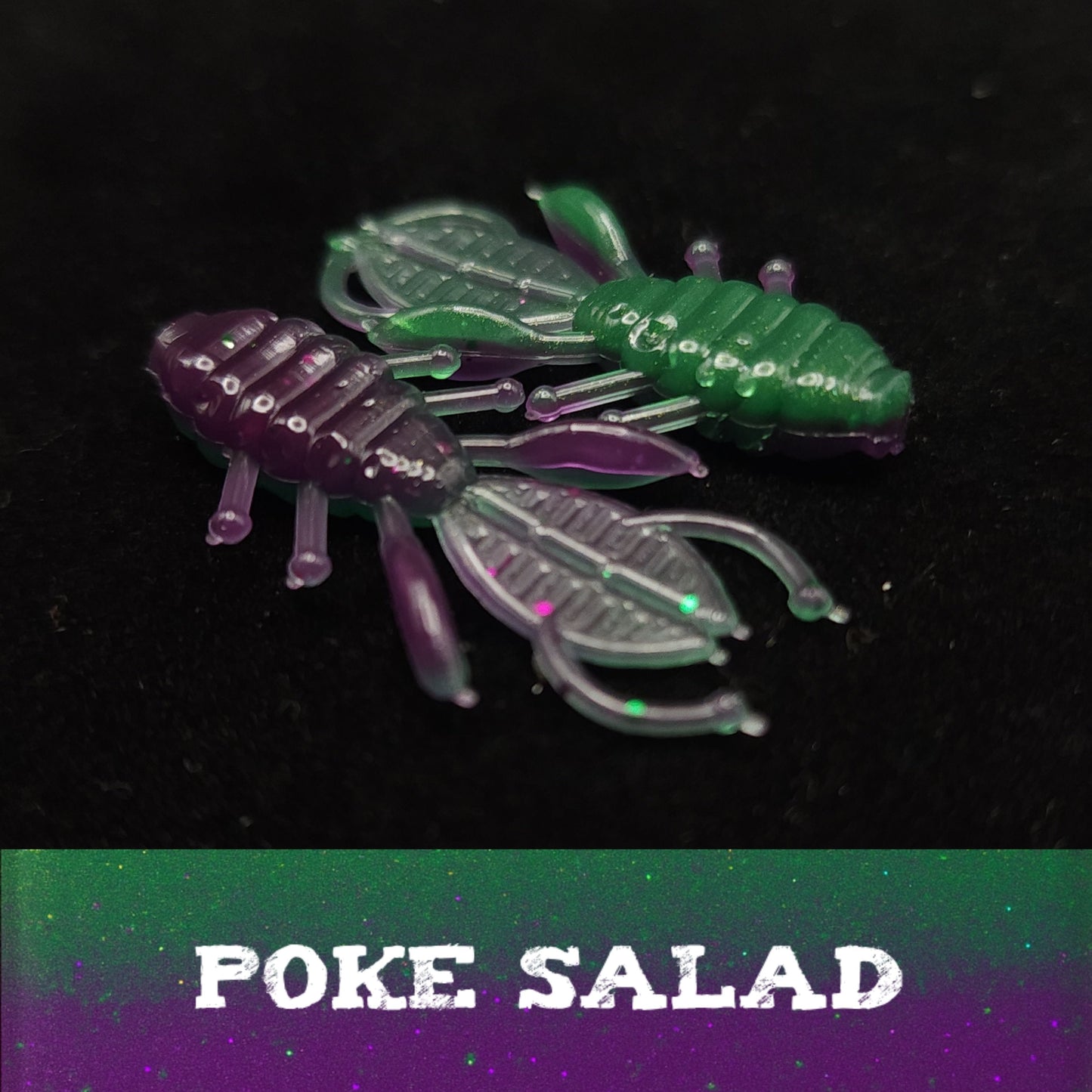 Two green and purple insect-shaped toys on a black background with 'POKE SALAD' text.