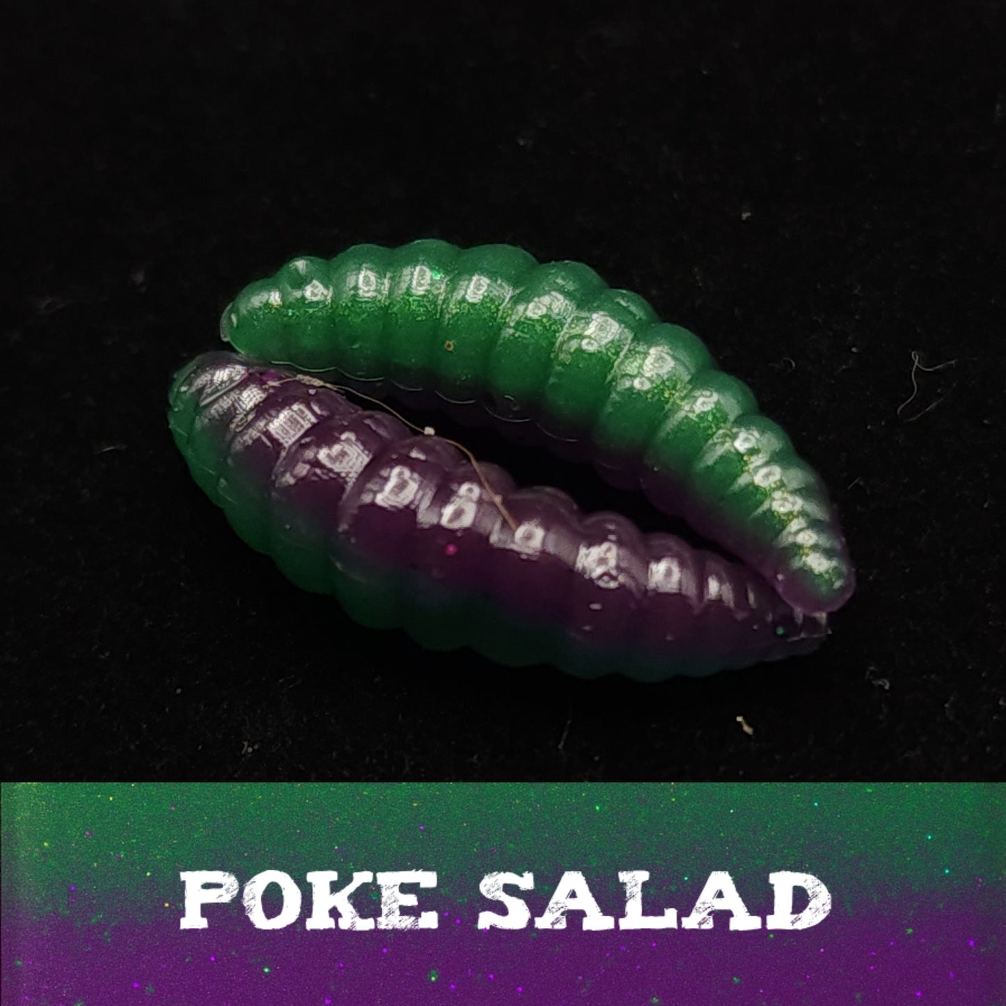 Two green and purple larvae fishing lures on a black background with 'POKE SALAD' text.