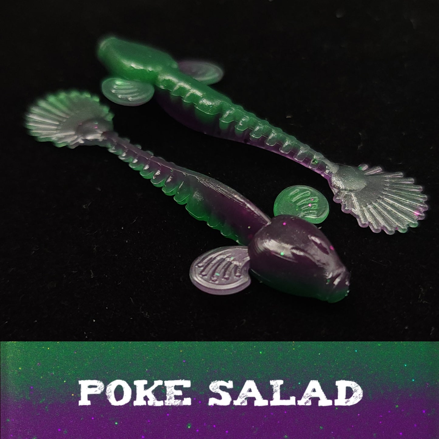 Two green and purple fishing lures on a black background with 'Poke Salad' text.