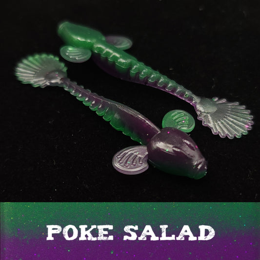 Two green and purple fishing lures on a black background with 'Poke Salad' text.