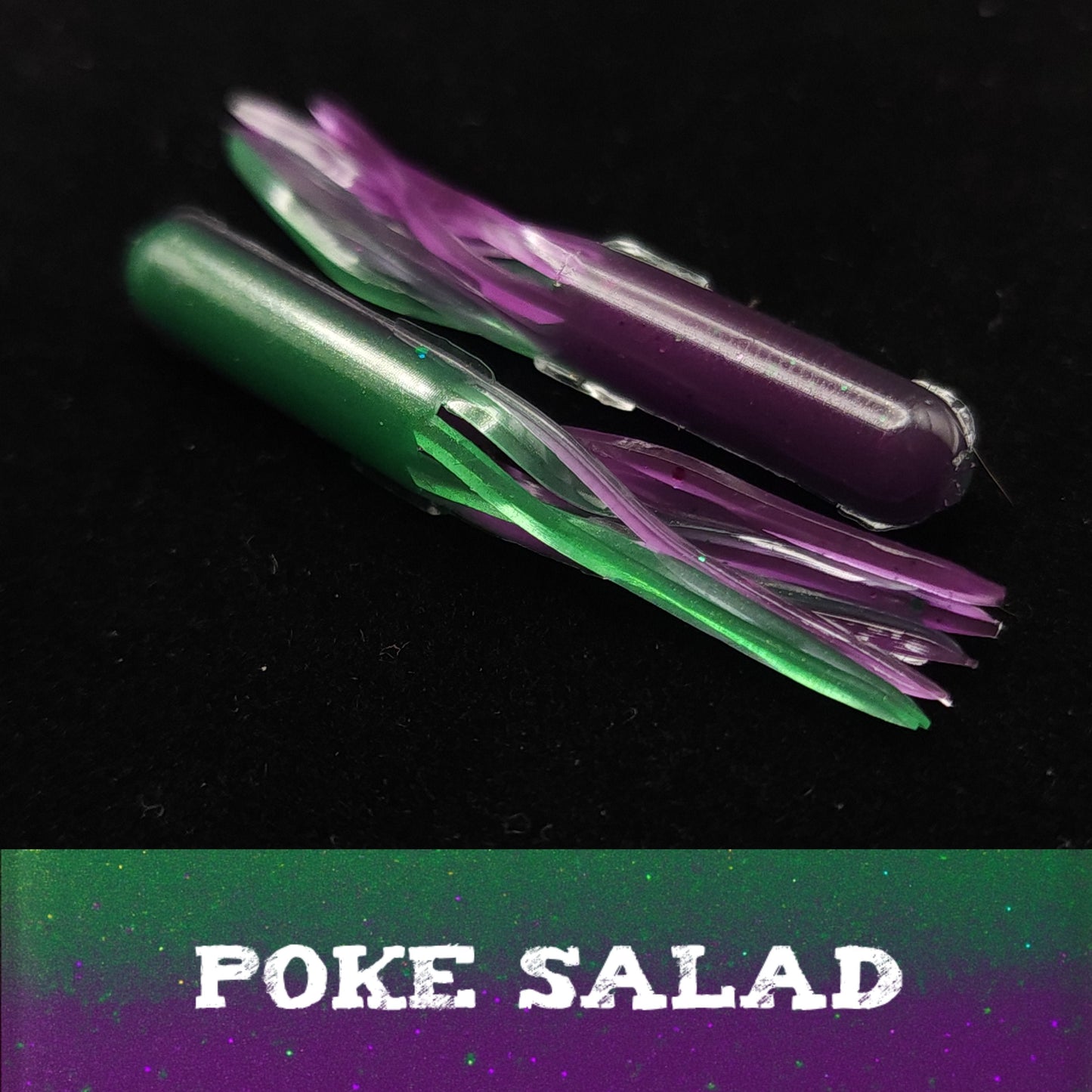 Green and purple plastic fishing lures  on a black background with 'POKE SALAD' text.