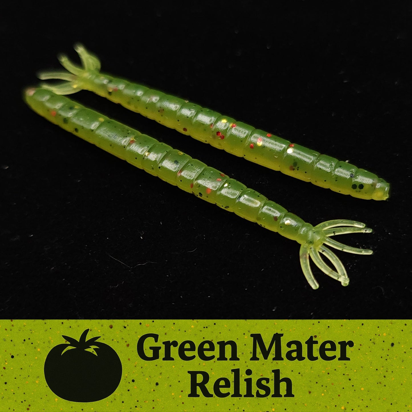 Two green fishing lures with red specks on a black background, labeled 'Green Mater Relish'.