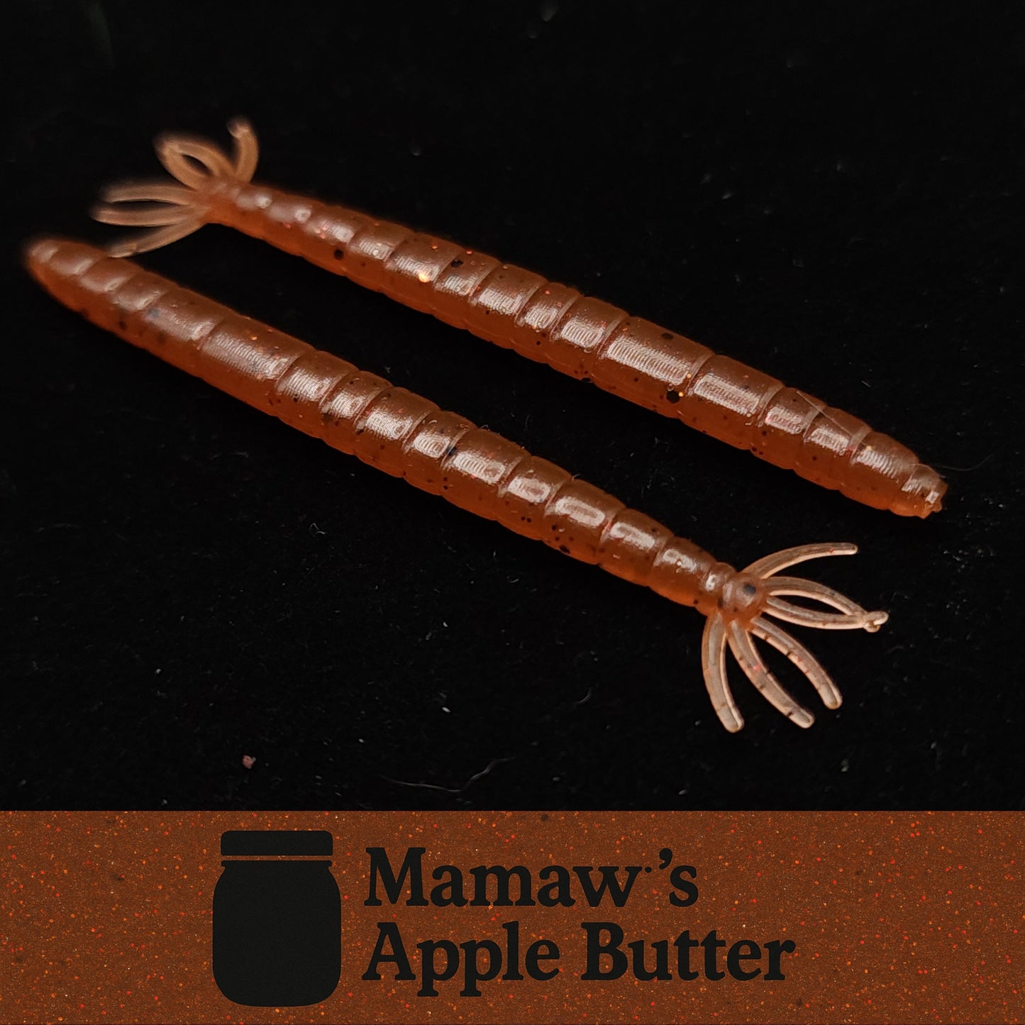 Two brownish orange fishing lures on a black background with 'Mamaw's Apple Butter' branding.