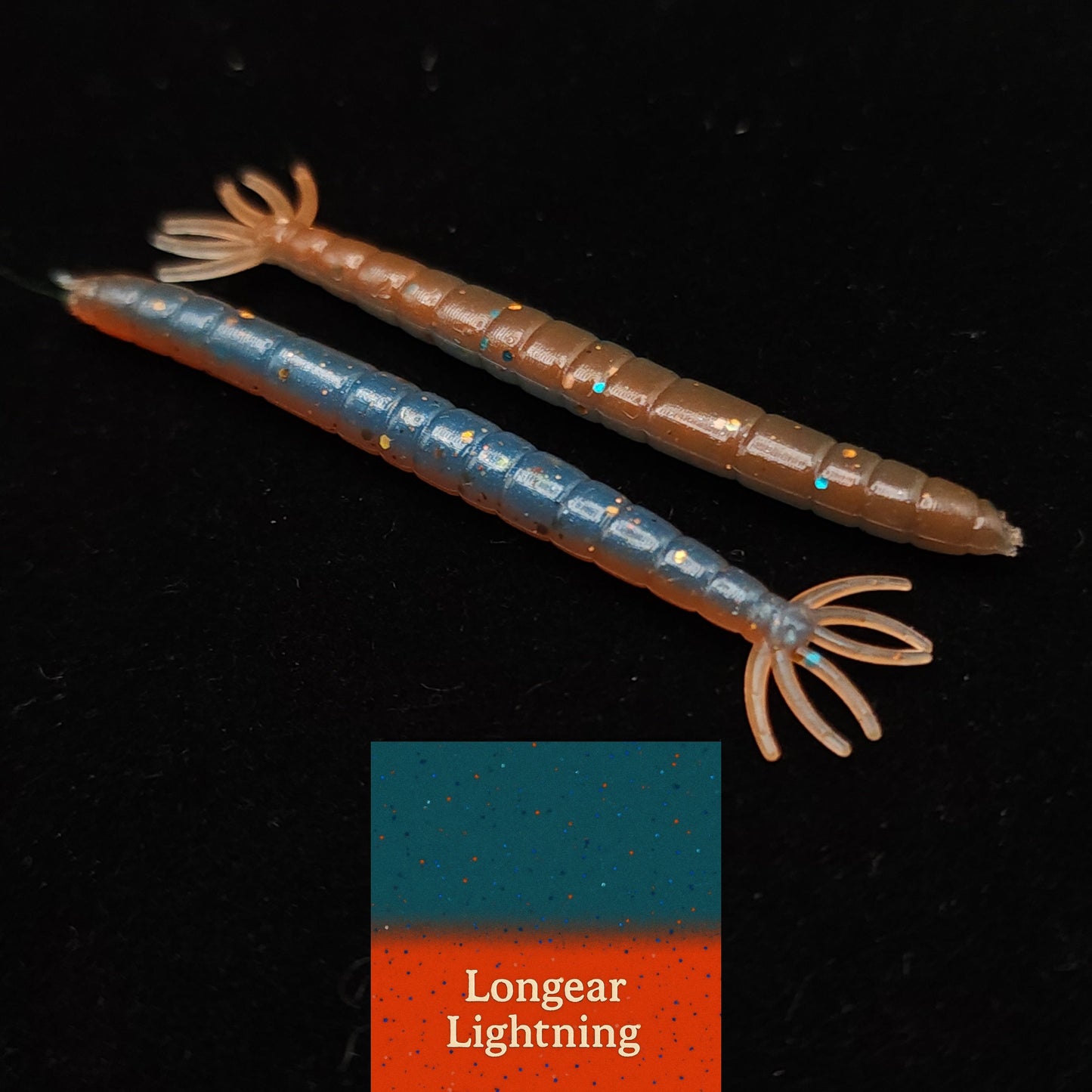 Two fishing lures with a 'Longear Lightning' label on a black background
